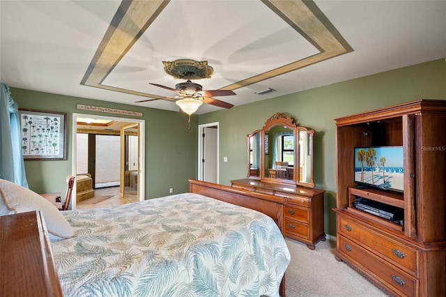 bedroom featuring light carpet and ceiling fan