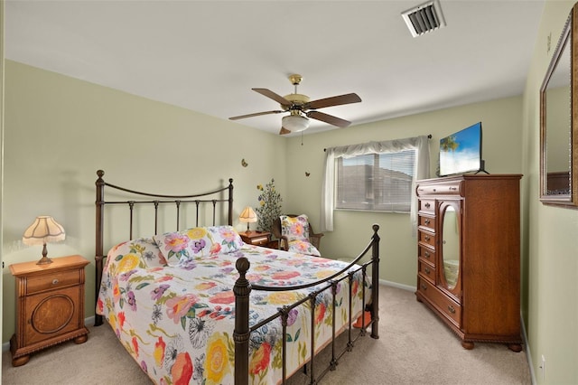 bedroom with light carpet and ceiling fan