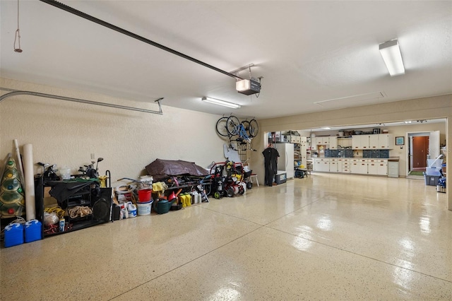 garage featuring a garage door opener