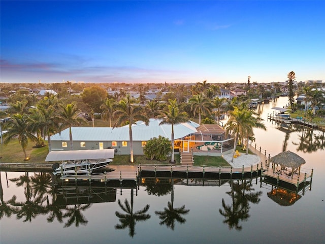 aerial view at dusk with a water view