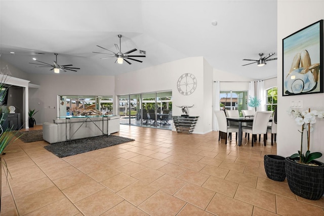 tiled living room featuring vaulted ceiling and ceiling fan