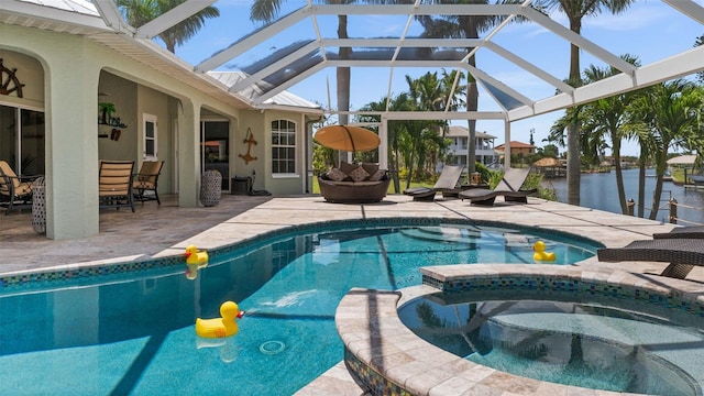 view of pool with a patio area, a water view, glass enclosure, outdoor lounge area, and an in ground hot tub