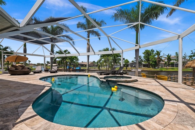 view of pool with a lanai, a patio area, and an in ground hot tub