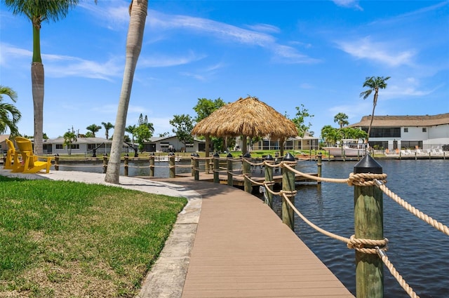 view of dock with a gazebo and a water view