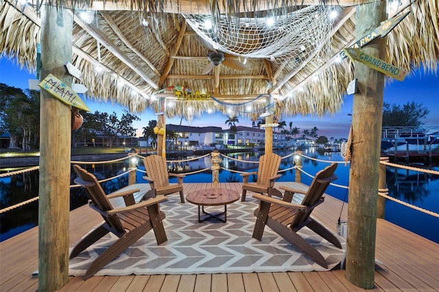 dock area with a water view and a gazebo