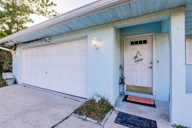 property entrance with a garage