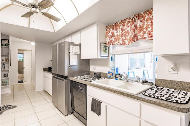 kitchen featuring light tile patterned flooring, white cabinetry, dishwasher, sink, and ceiling fan