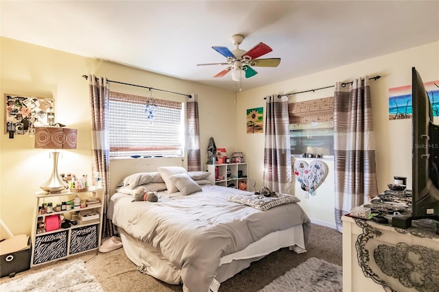 bedroom with ceiling fan and carpet