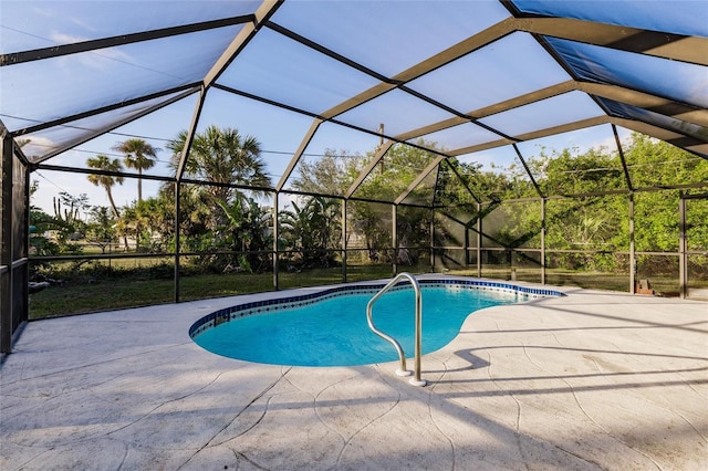 view of swimming pool featuring a lanai and a patio