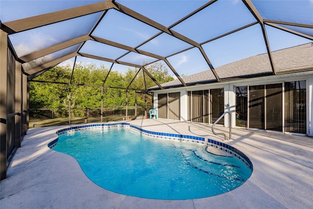 view of pool featuring a patio and glass enclosure