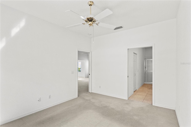 carpeted empty room featuring ceiling fan