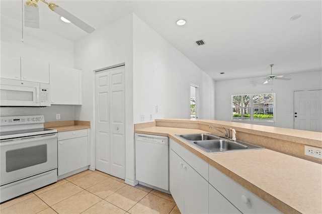 kitchen with sink, white cabinets, light tile patterned floors, ceiling fan, and white appliances