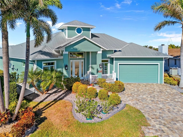 view of front of house with a garage and a porch