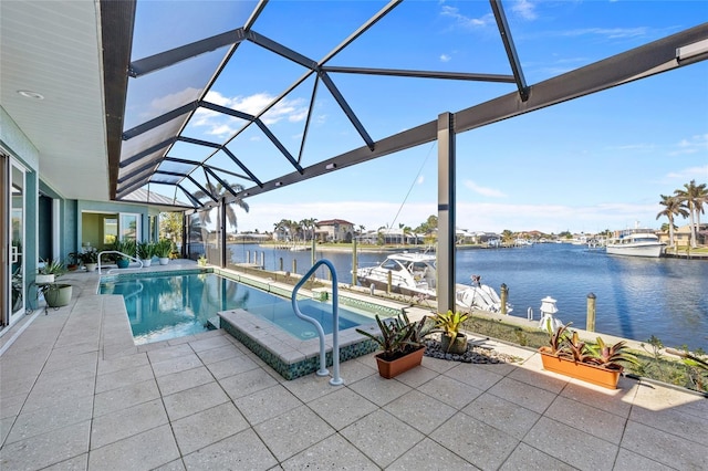 view of pool with a water view, a patio, a lanai, and a jacuzzi