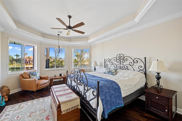 bedroom featuring crown molding, dark hardwood / wood-style flooring, and multiple windows