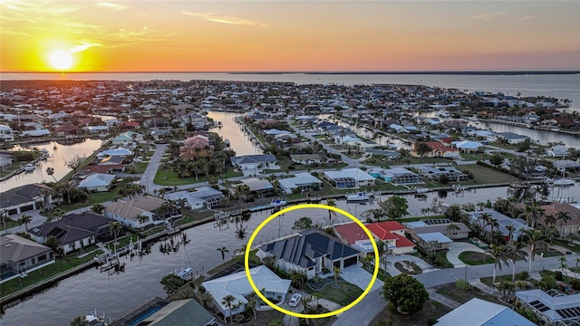 aerial view at dusk with a water view