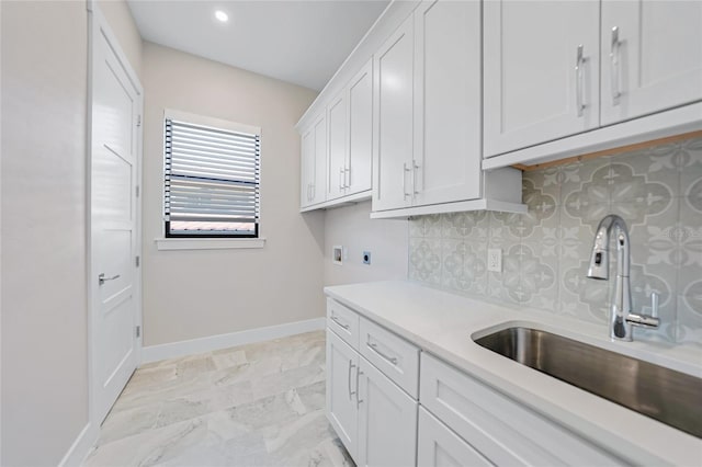 laundry room featuring cabinets, washer hookup, hookup for an electric dryer, and sink