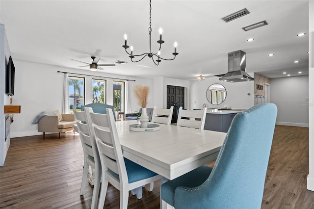 dining space with dark wood-type flooring and ceiling fan