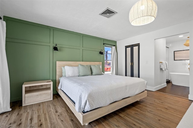 bedroom featuring wood-type flooring