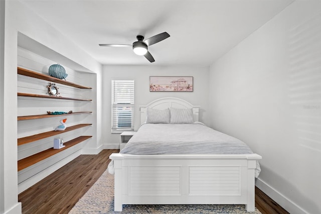 bedroom featuring dark hardwood / wood-style flooring and ceiling fan