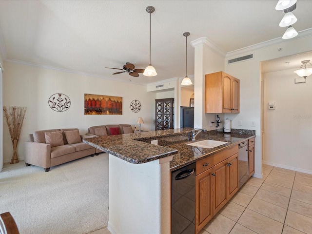 kitchen with sink, decorative light fixtures, dark stone countertops, stainless steel dishwasher, and kitchen peninsula