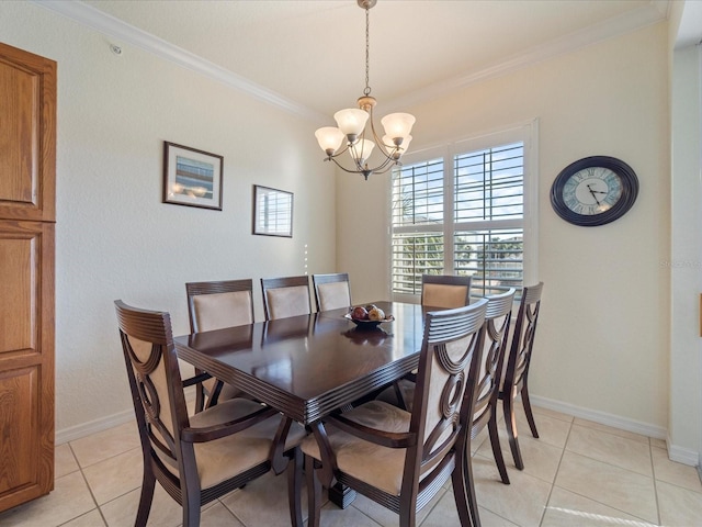 tiled dining area featuring ornamental molding and a chandelier