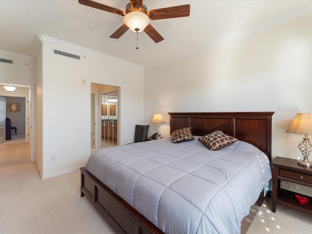 carpeted bedroom with crown molding, ceiling fan, and ensuite bath