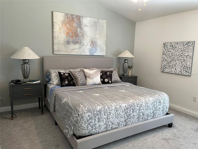 bedroom with lofted ceiling and carpet