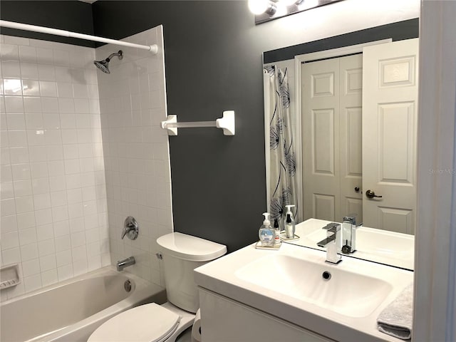 full bathroom featuring vanity, toilet, and tiled shower / bath combo