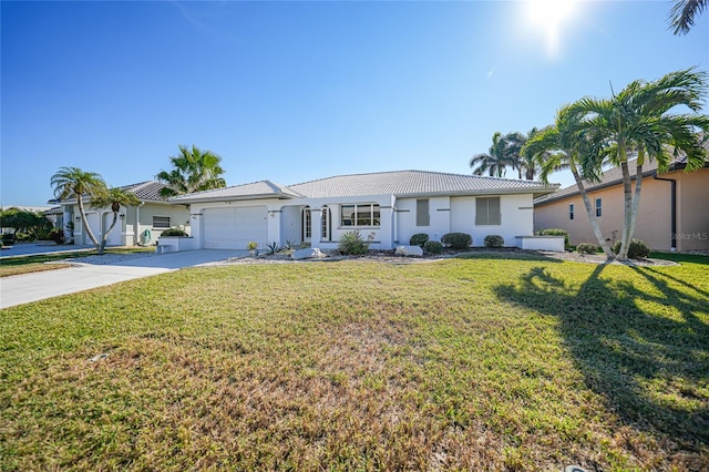 single story home with a garage and a front lawn