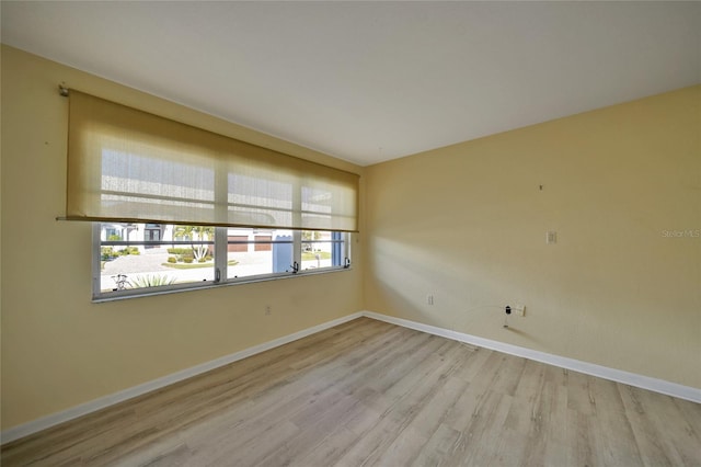 empty room with light hardwood / wood-style floors