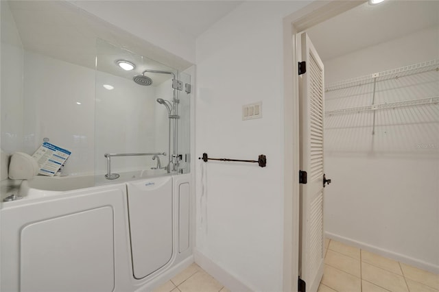 bathroom featuring walk in shower and tile patterned floors