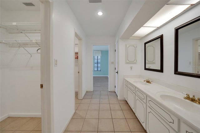 bathroom with vanity and tile patterned floors