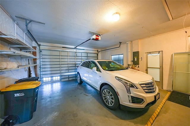 garage featuring a garage door opener and electric panel