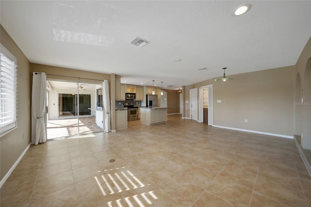 unfurnished living room featuring light tile patterned flooring