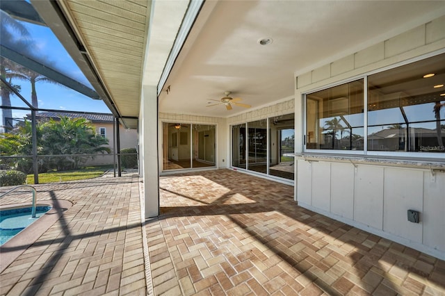 view of patio with a lanai and ceiling fan