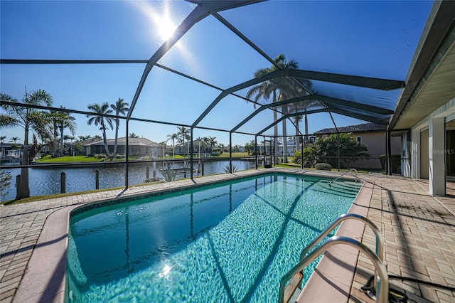 view of swimming pool featuring a lanai, a patio area, and a water view