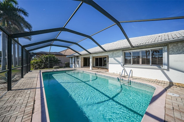 view of pool featuring a lanai and a patio area