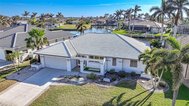 birds eye view of property featuring a water view