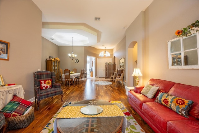 living room featuring hardwood / wood-style flooring and a chandelier