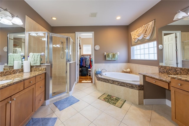 bathroom with vanity, separate shower and tub, and tile patterned flooring