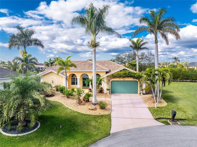 mediterranean / spanish house with a garage and a front lawn