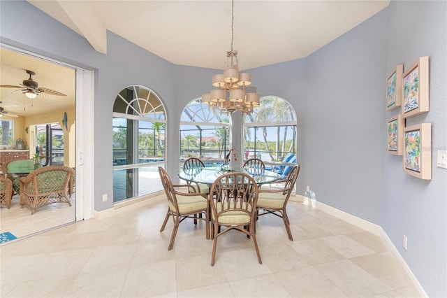 dining area featuring ceiling fan with notable chandelier