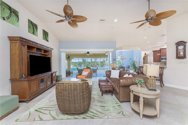 living room with high vaulted ceiling and ceiling fan