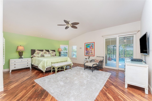 bedroom with lofted ceiling, access to exterior, dark hardwood / wood-style floors, and ceiling fan