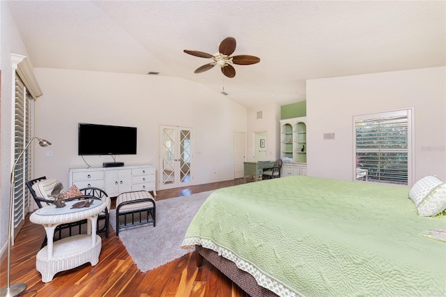 bedroom with hardwood / wood-style flooring, vaulted ceiling, and ceiling fan