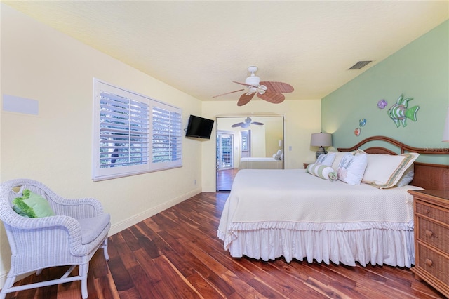 bedroom featuring dark hardwood / wood-style flooring and ceiling fan