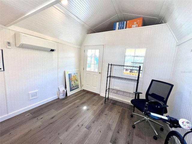 interior space with dark hardwood / wood-style flooring, vaulted ceiling, and an AC wall unit