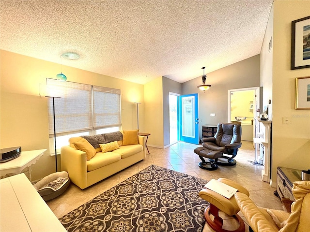 living room featuring light tile patterned flooring, lofted ceiling, and a textured ceiling