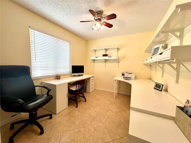 office space with ceiling fan, a textured ceiling, and light tile patterned flooring